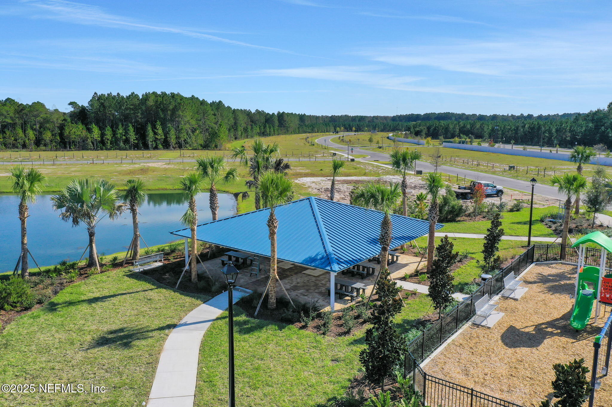 3761 Athenian Way Middleburg, FL 32068 - Photo 44 of 49 an aerial view of a house with a garden and lake view
