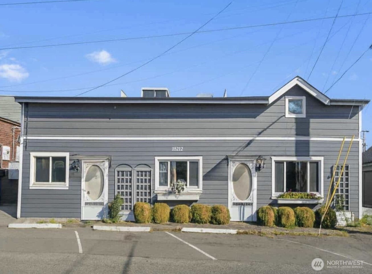 15212 9th Avenue Southwest Burien, WA 98166 - Photo 2 of 14 a front view of a house with a porch