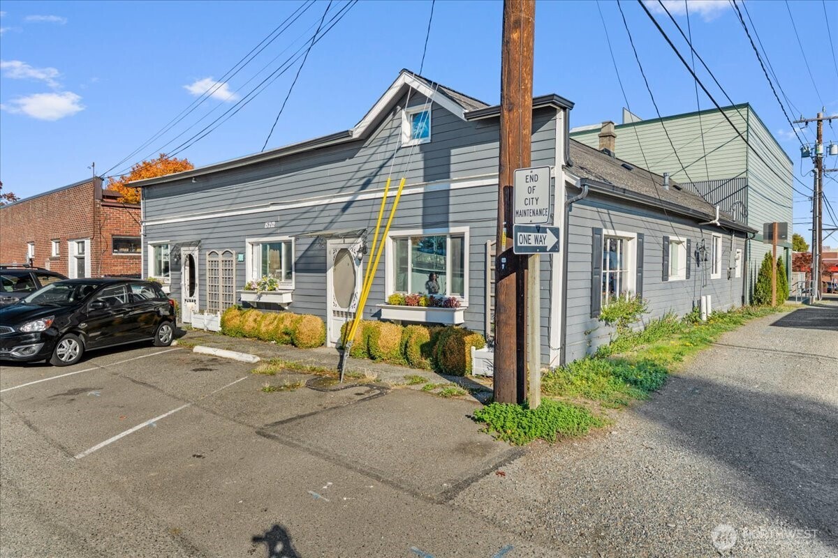 15212 9th Avenue Southwest Burien, WA 98166 - Photo 3 of 14 a view of a house with couches chairs under an umbrella