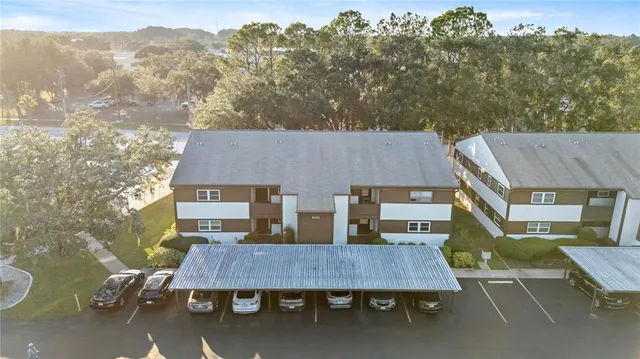 a aerial view of a house with table and chairs