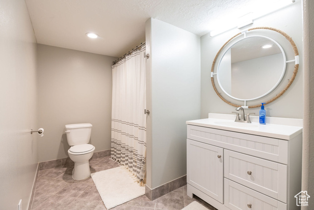 2280 South 450 West Perry, UT 84302 - Photo 11 of 38 Full bathroom featuring vanity, light tile patterned floors, curtained shower, and recessed lighting