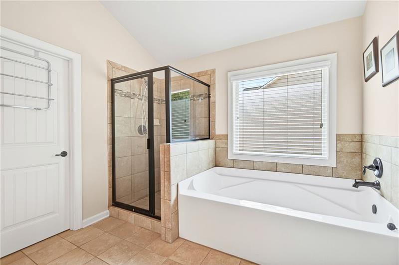 3225 Sundew Drive Acworth, GA 30101 - Photo 17 of 37 a spacious bathroom with a bathtub and a shower