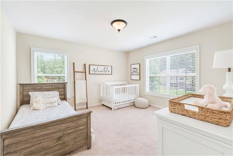 3225 Sundew Drive Acworth, GA 30101 - Photo 21 of 37 a bedroom with a bed and windows