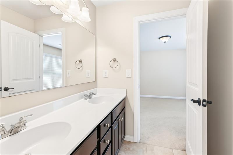 3225 Sundew Drive Acworth, GA 30101 - Photo 23 of 37 a bathroom with a sink vanity and a mirror
