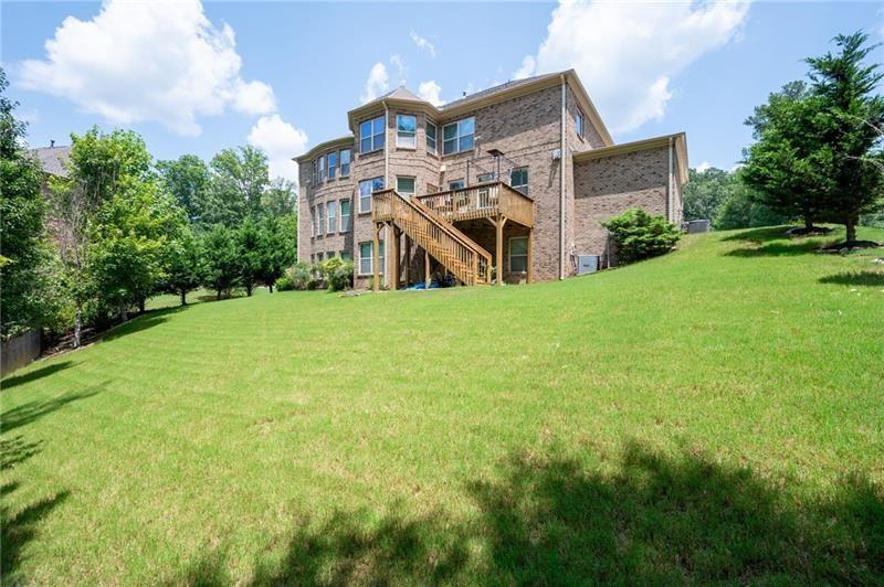 3225 Sundew Drive Acworth, GA 30101 - Photo 30 of 37 a view of a house with a yard and potted plants