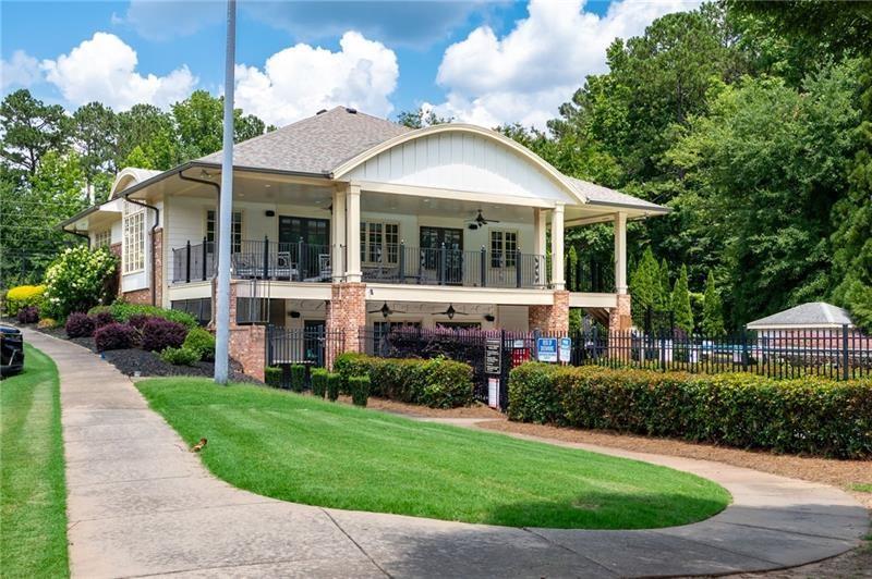 3225 Sundew Drive Acworth, GA 30101 - Photo 36 of 37 a view of a white house with a big yard and potted plants