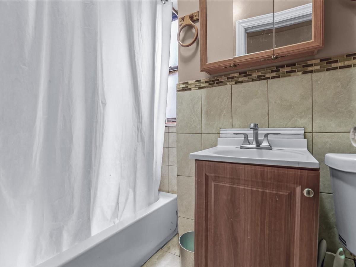 246 Cornelia Street, Unit B2 Brooklyn, NY 11221 - Photo 10 of 10 a bathroom with a sink and a mirror
