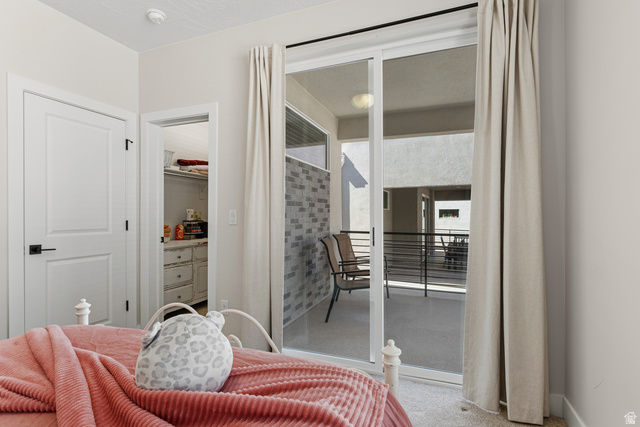 839 Walker Way St. George, UT 84770 - Photo 29 of 32 Sliding glass doors open to an outdoor patio with black metal railings