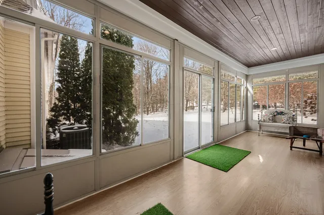 a room with furniture and a large window