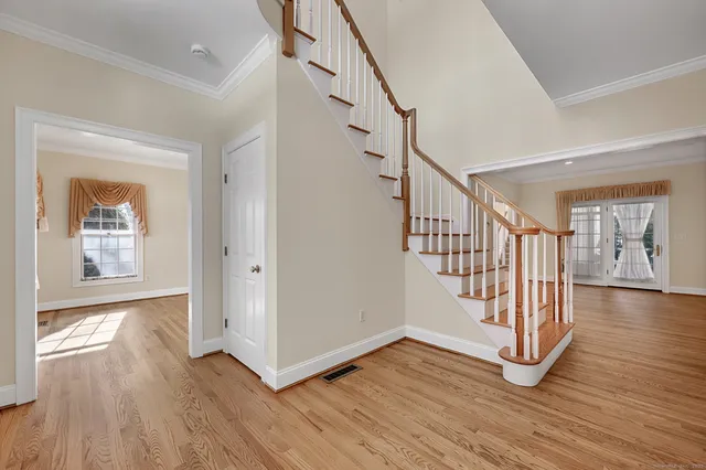 a view of entryway with wooden floor