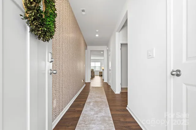 a view of a hallway with a potted plant