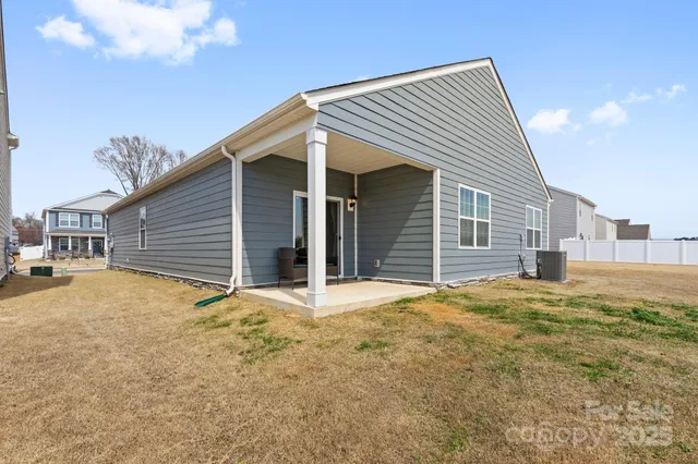 a view of yellow house with a outdoor space
