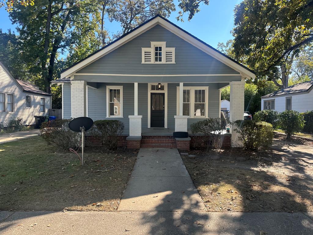 1432 22nd Street Columbus, GA 31901 - Photo 1 of 15 a front view of a house with garden