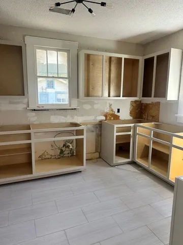 a kitchen with stainless steel appliances granite countertop a stove and a sink