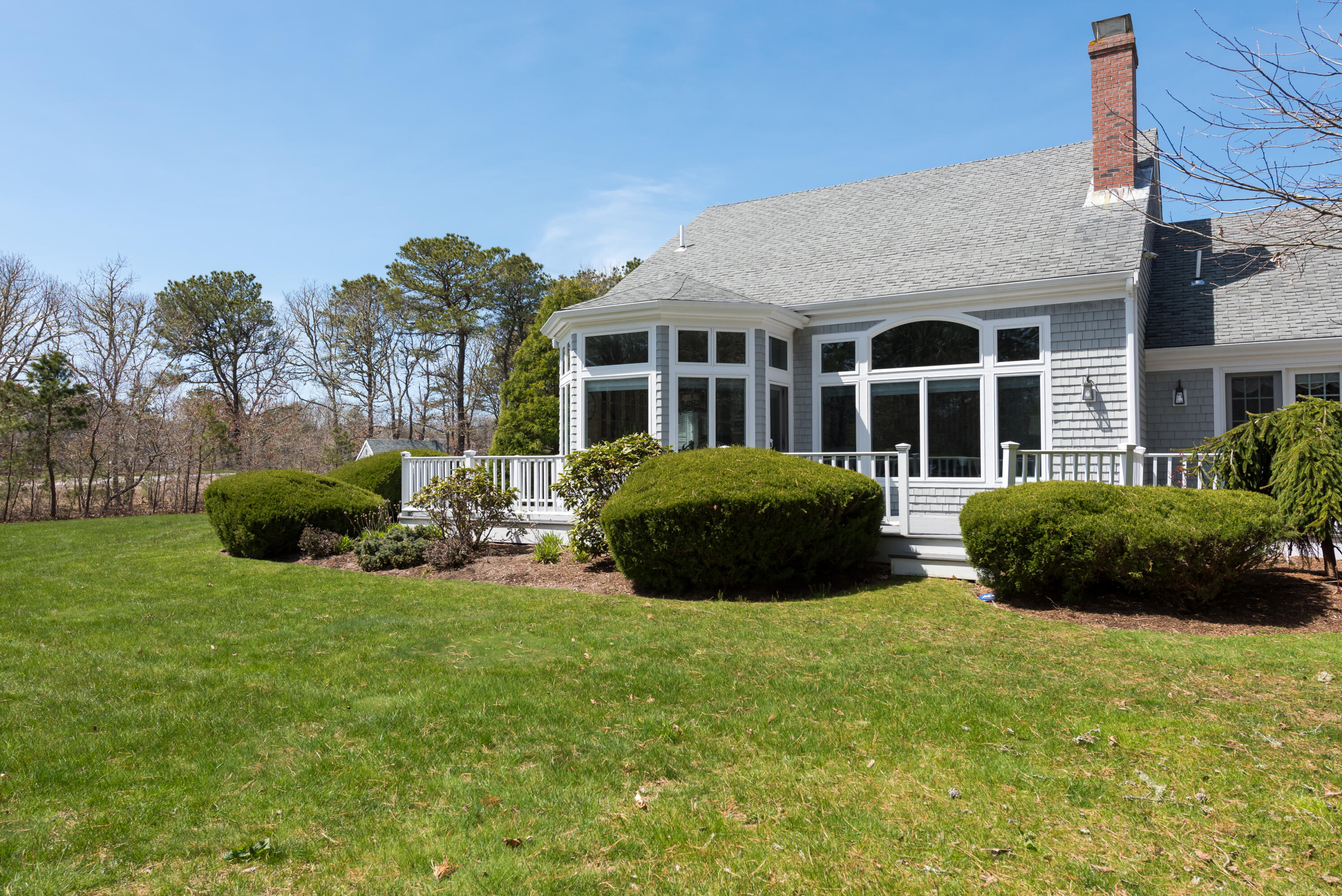 12 Somerset Road Harwich, MA 02645 - Photo 11 of 30 a view of a house with backyard sitting area and garden