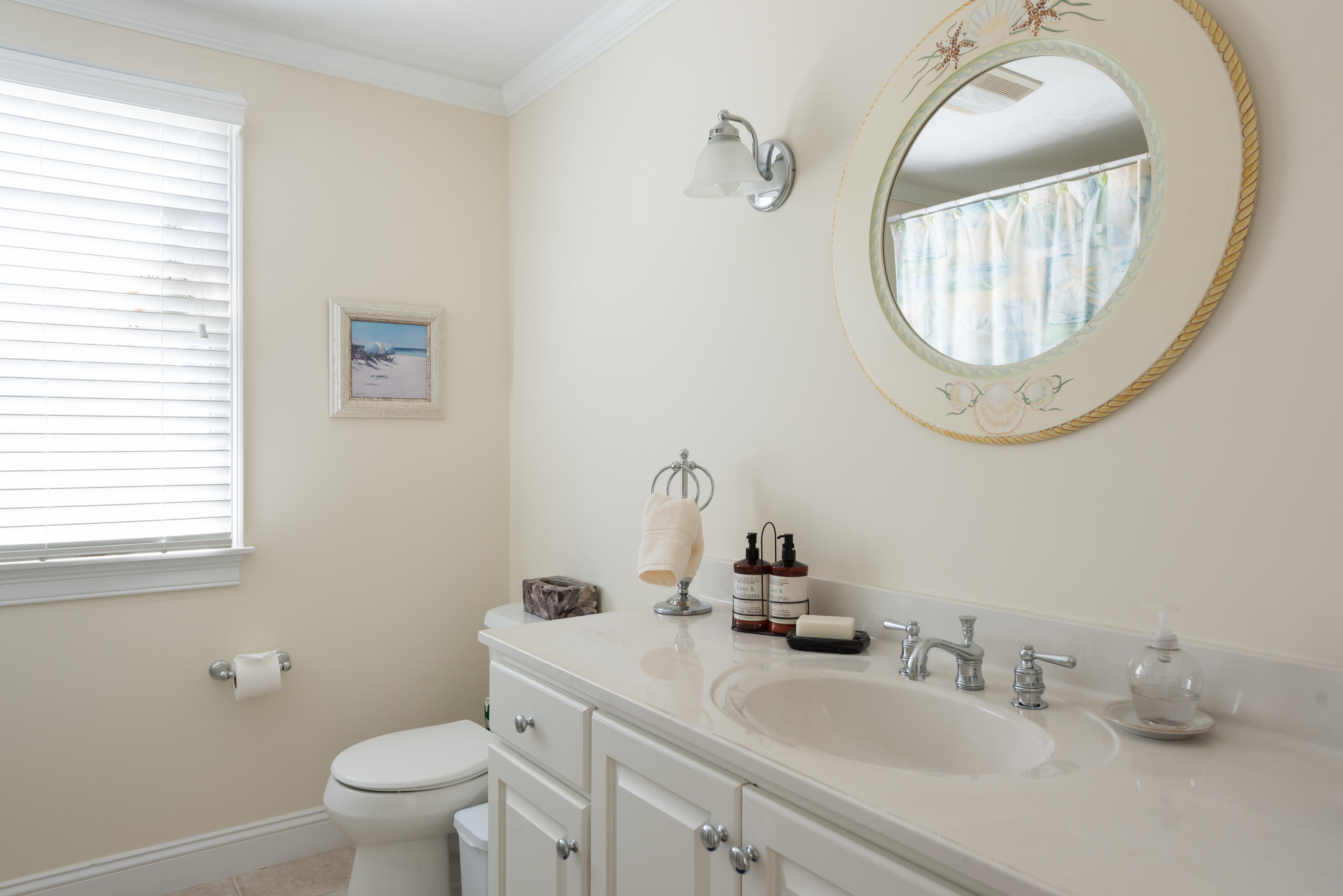 12 Somerset Road Harwich, MA 02645 - Photo 23 of 30 a bathroom with a toilet sink mirror and vanity
