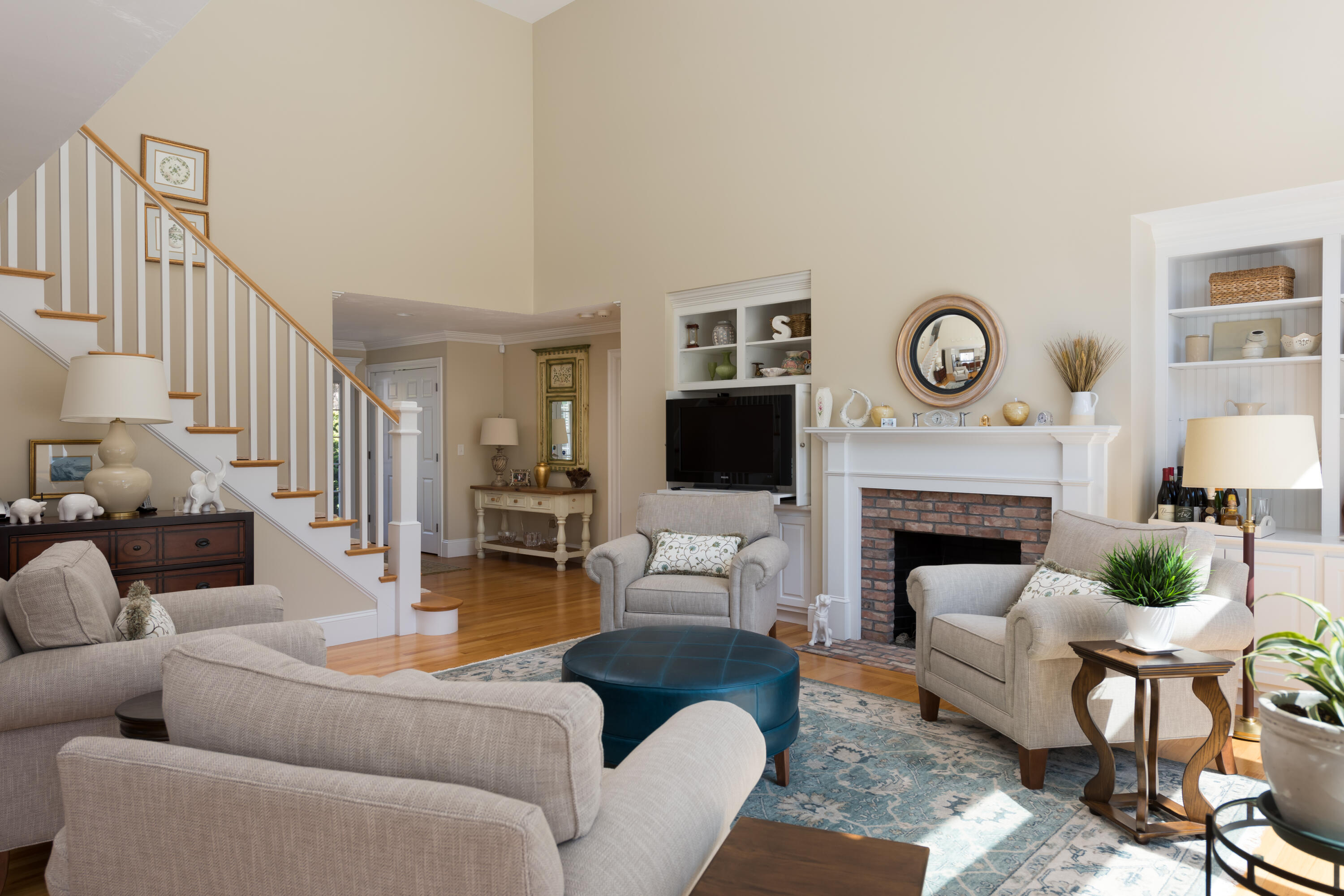 12 Somerset Road Harwich, MA 02645 - Photo 8 of 30 a living room with furniture a clock and a fireplace