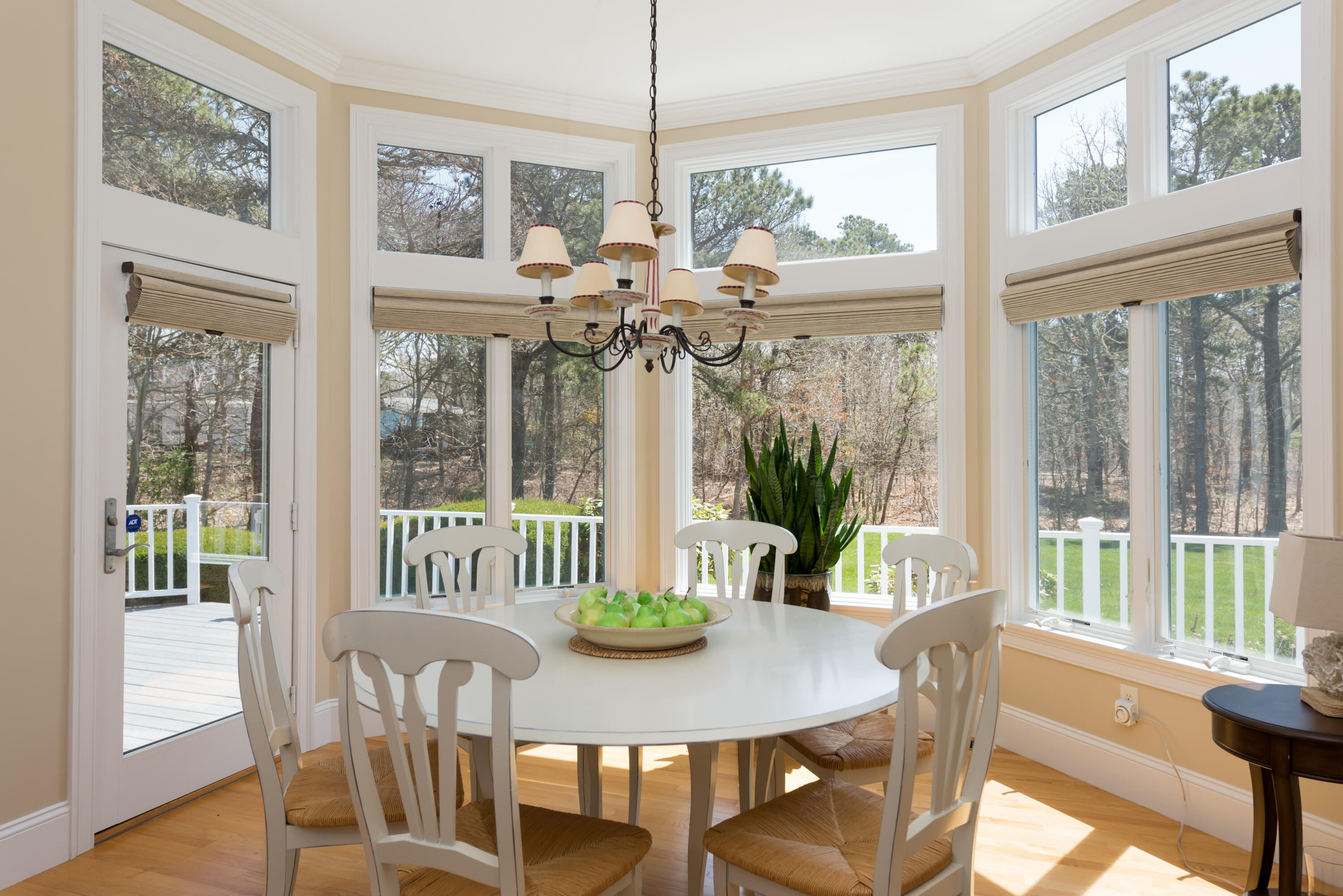 12 Somerset Road Harwich, MA 02645 - Photo 10 of 30 a view of a dining room with furniture large windows and wooden floor