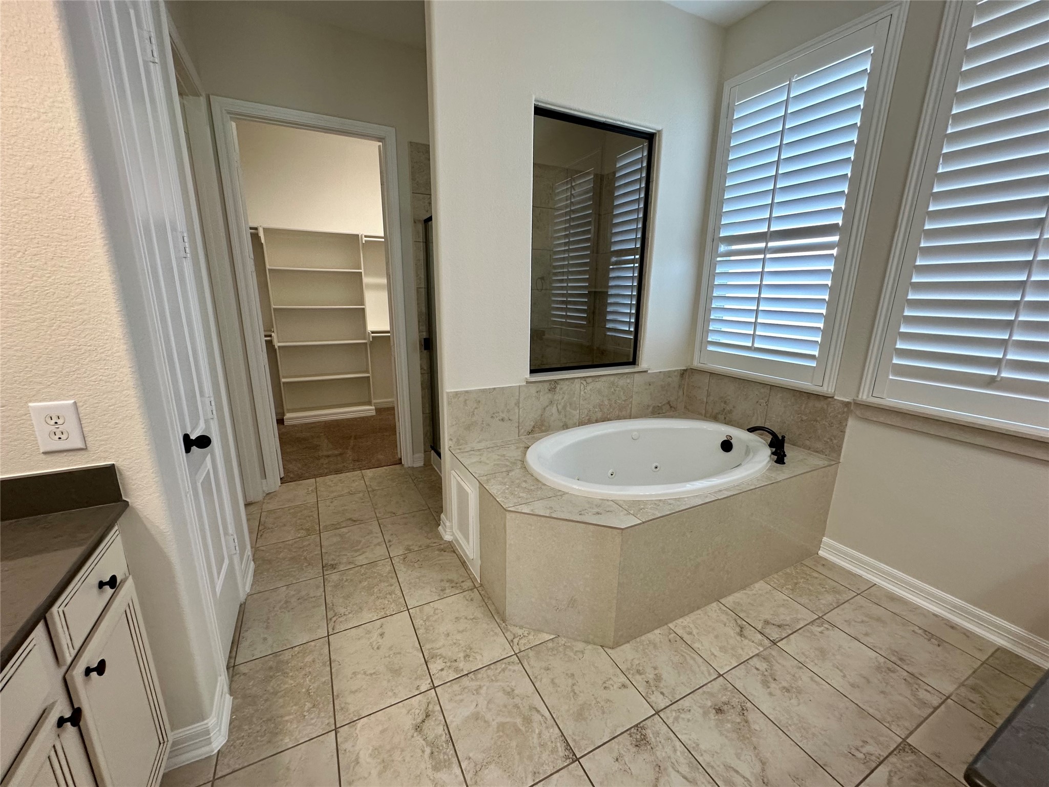 26507 Reflection Sky Court Katy, TX 77494 - Photo 12 of 24 a bathroom with a bathtub and window