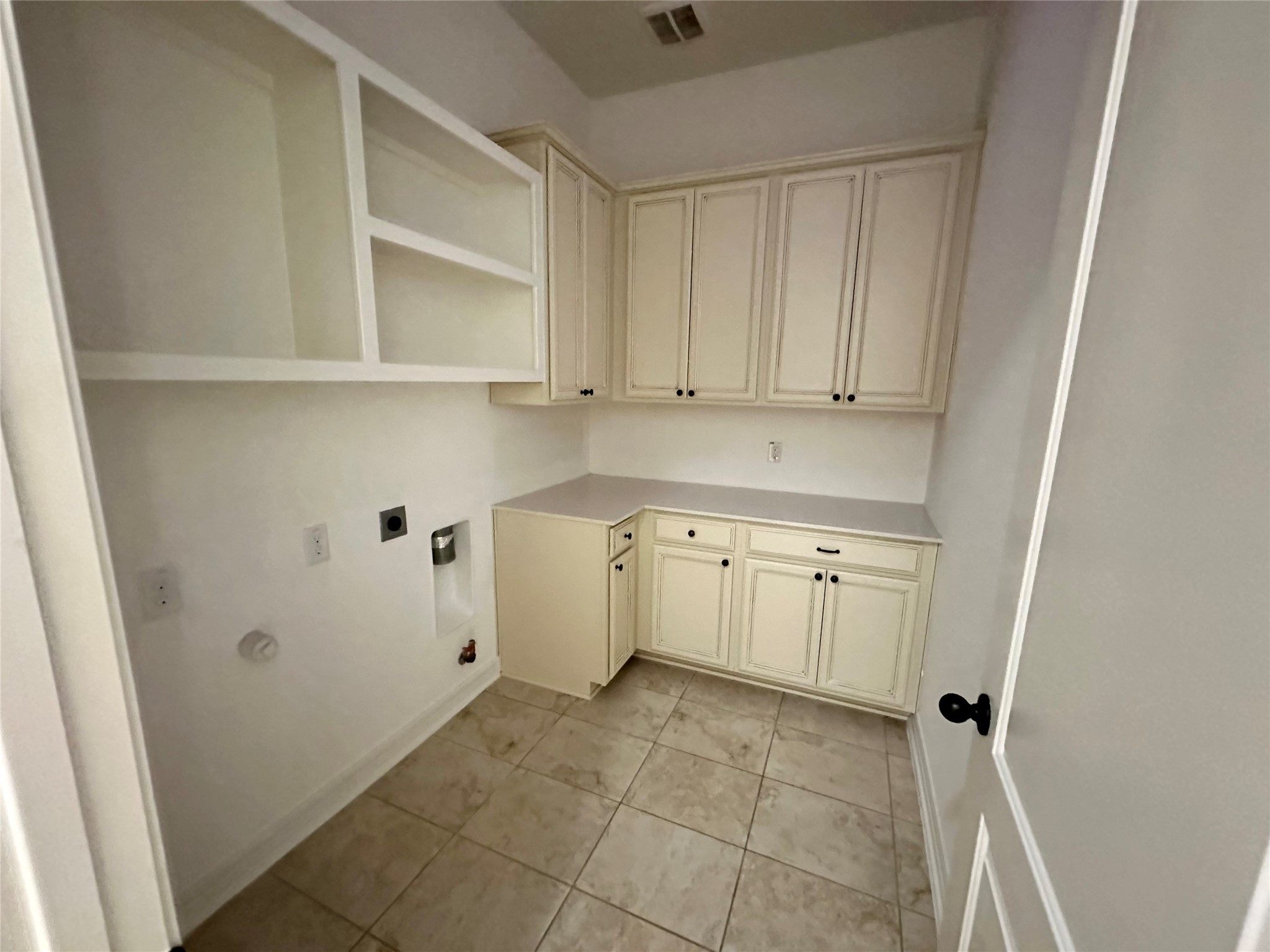 26507 Reflection Sky Court Katy, TX 77494 - Photo 14 of 24 a view of a kitchen with white cabinets