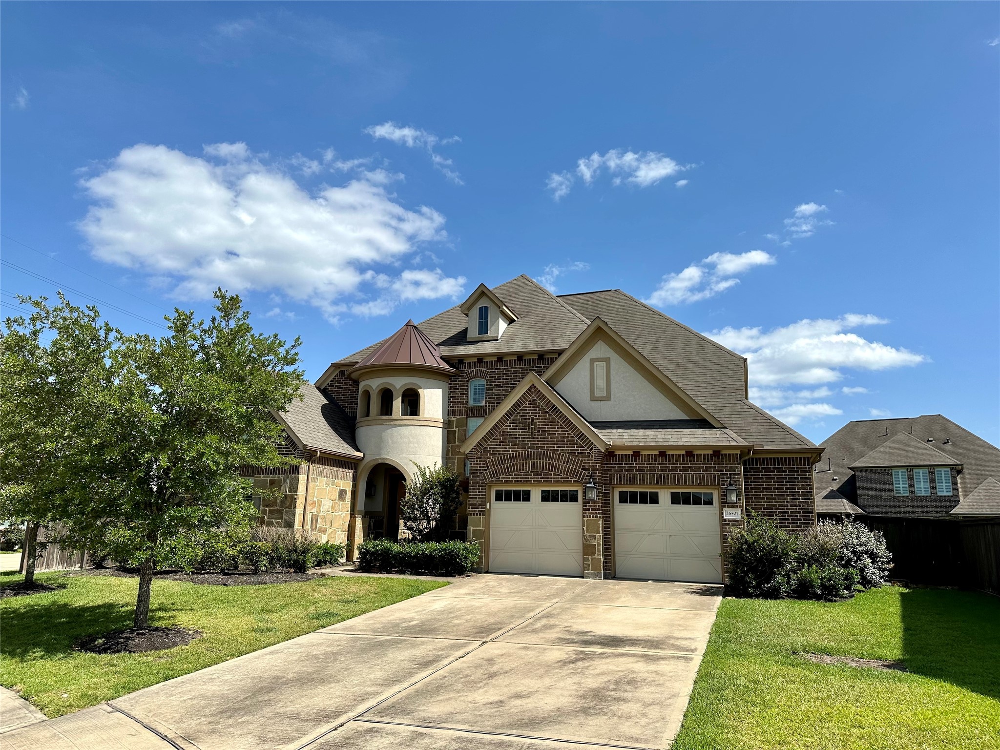 26507 Reflection Sky Court Katy, TX 77494 - Photo 2 of 24 a front view of a house with a yard