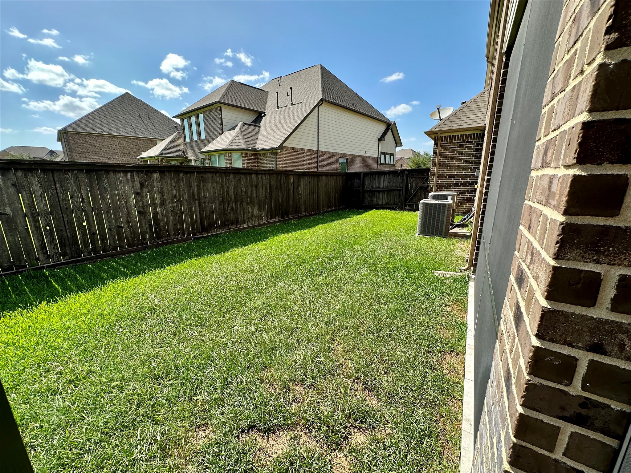 26507 Reflection Sky Court Katy, TX 77494 - Photo 23 of 24 a front view of a house with a yard