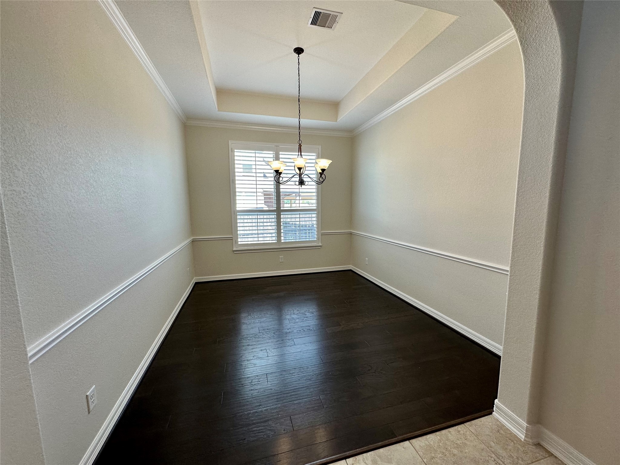 26507 Reflection Sky Court Katy, TX 77494 - Photo 3 of 24 a view of an empty room with wooden floor and a window