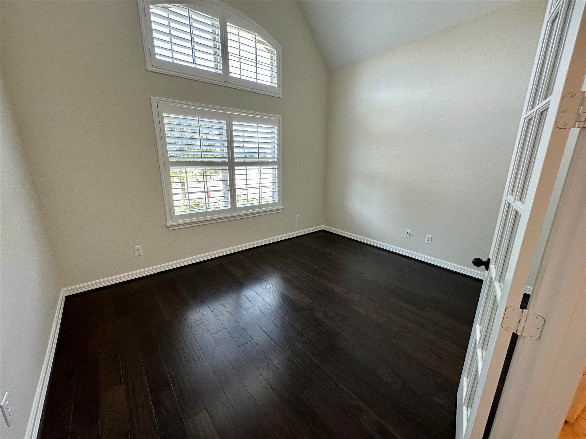 26507 Reflection Sky Court Katy, TX 77494 - Photo 4 of 24 an empty room with wooden floor and windows