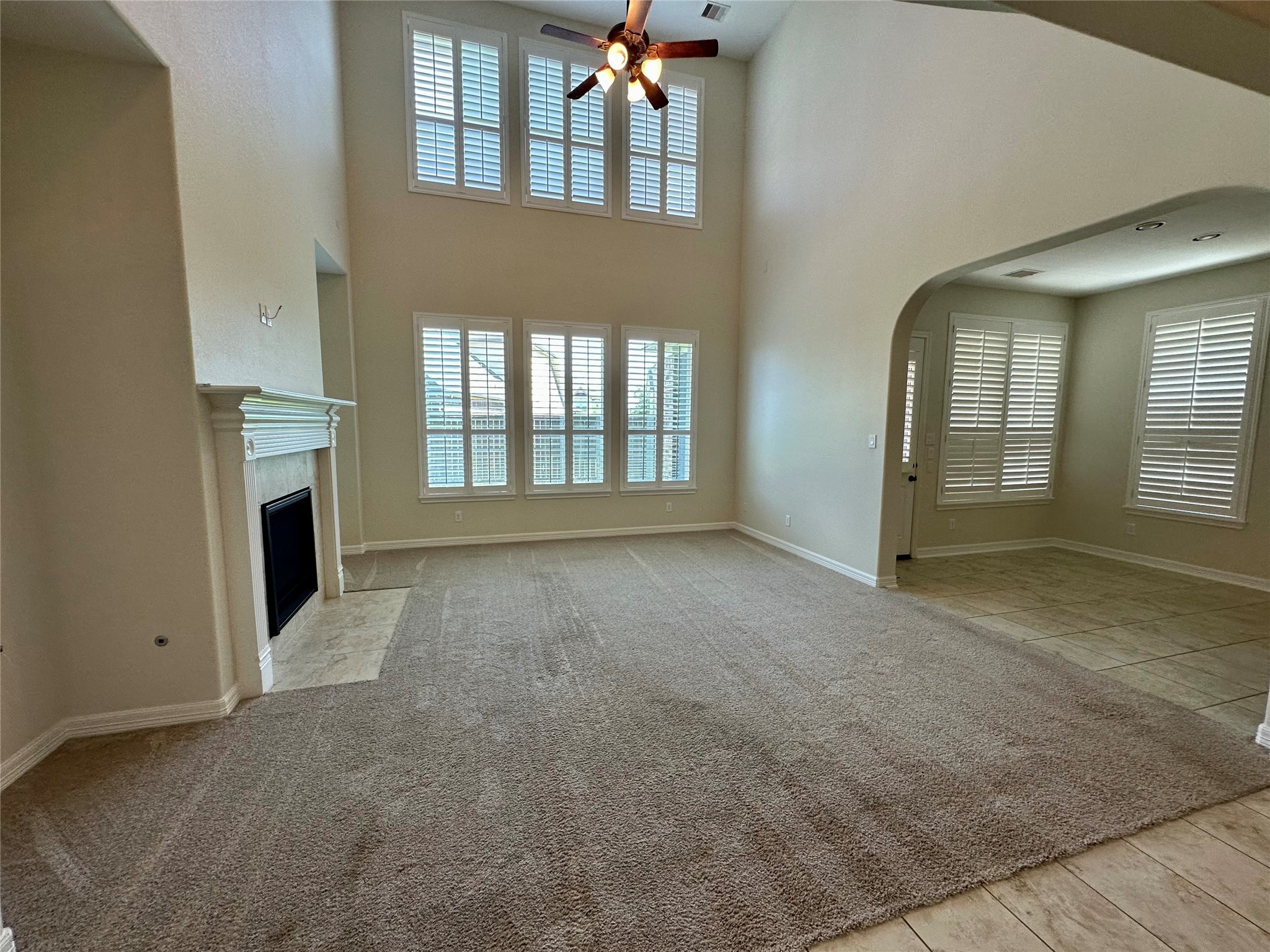 26507 Reflection Sky Court Katy, TX 77494 - Photo 6 of 24 an empty room with windows