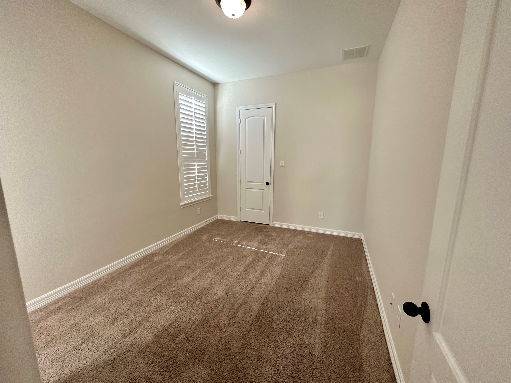 26507 Reflection Sky Court Katy, TX 77494 - Photo 10 of 24 a view of an empty room and window