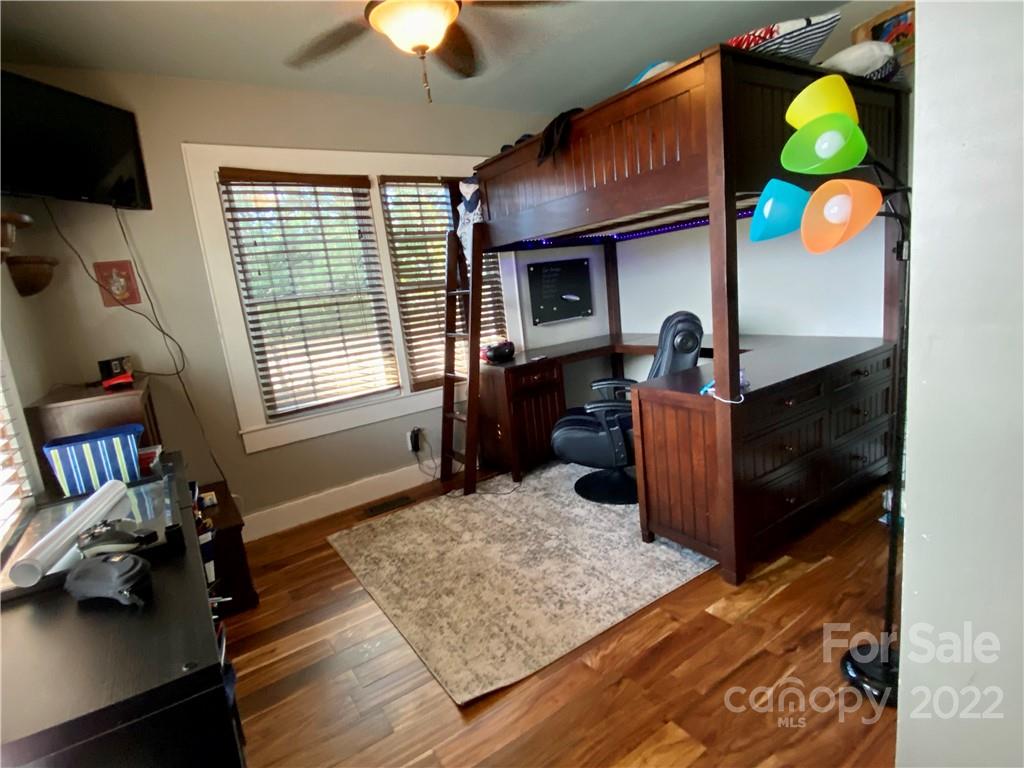 512 Blacksnake Road Stanley, NC 28164 - Photo 9 of 19 a living room with furniture and a flat screen tv
