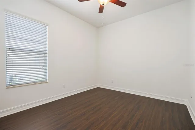 an empty room with wooden floor