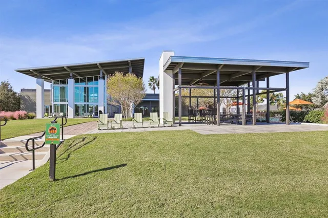 a reading room with furniture and a rug