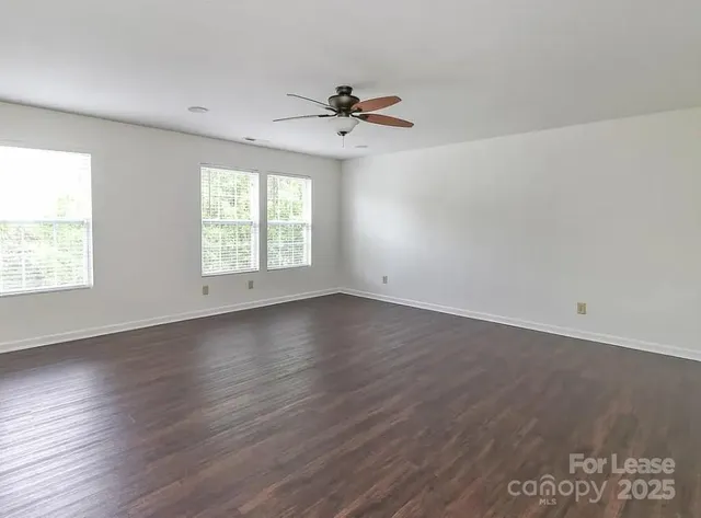 a bathroom with a shower and a glass door