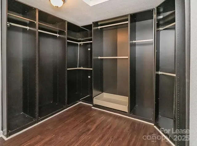 a bathroom with a granite countertop sink a toilet and bathtub