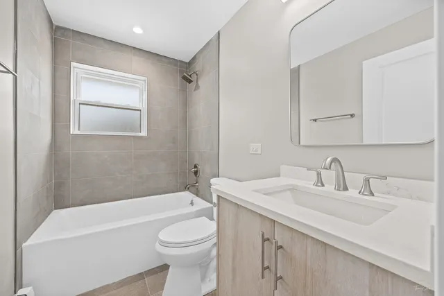 a bathroom with a sink a toilet and a bathtub