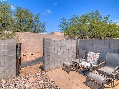 a backyard of a house with seating space