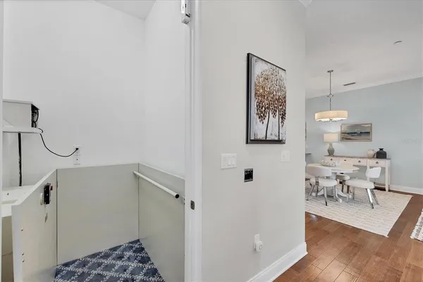a large kitchen with a table and chairs