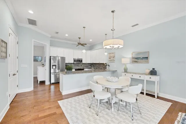 a living room with fireplace furniture and a large window
