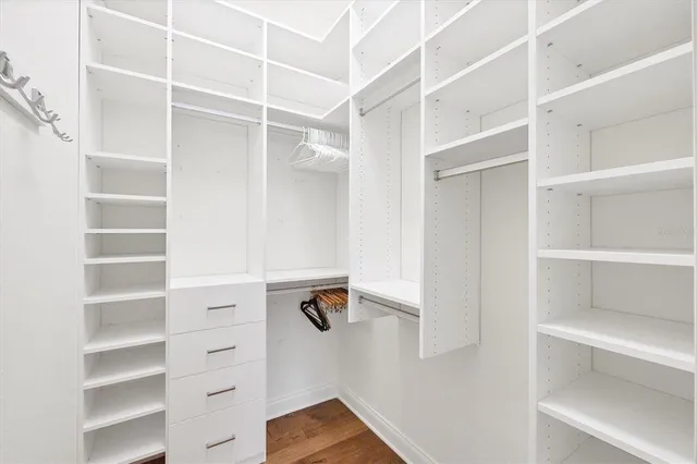 a spacious bathroom with a double vanity sink and a mirror
