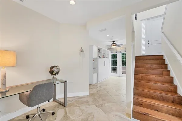 a bathroom with a sink vanity mirror and toilet