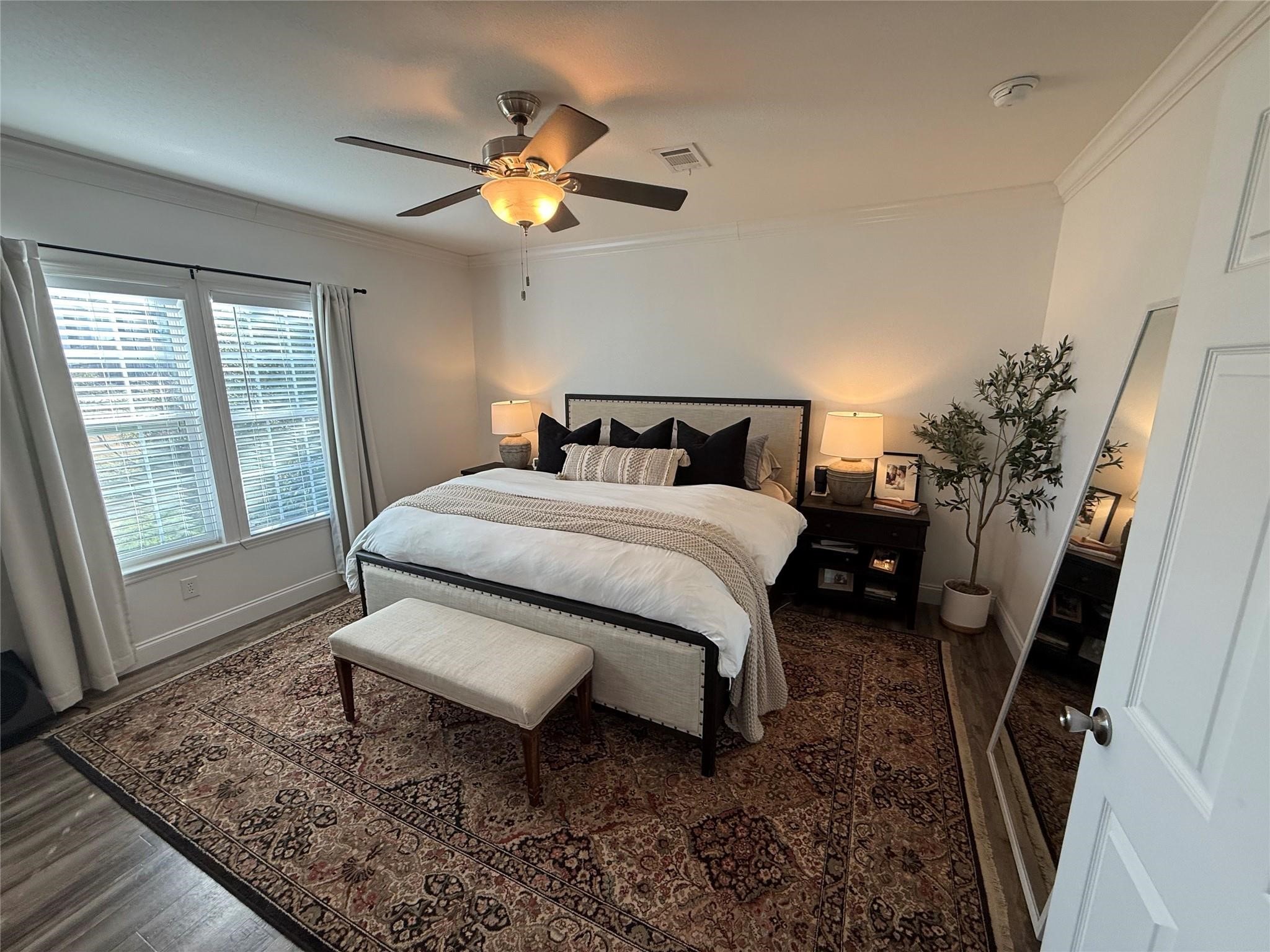 16607 Mueschke Road Cypress, TX 77433 - Photo 19 of 24 a bed sitting in a room next to a window