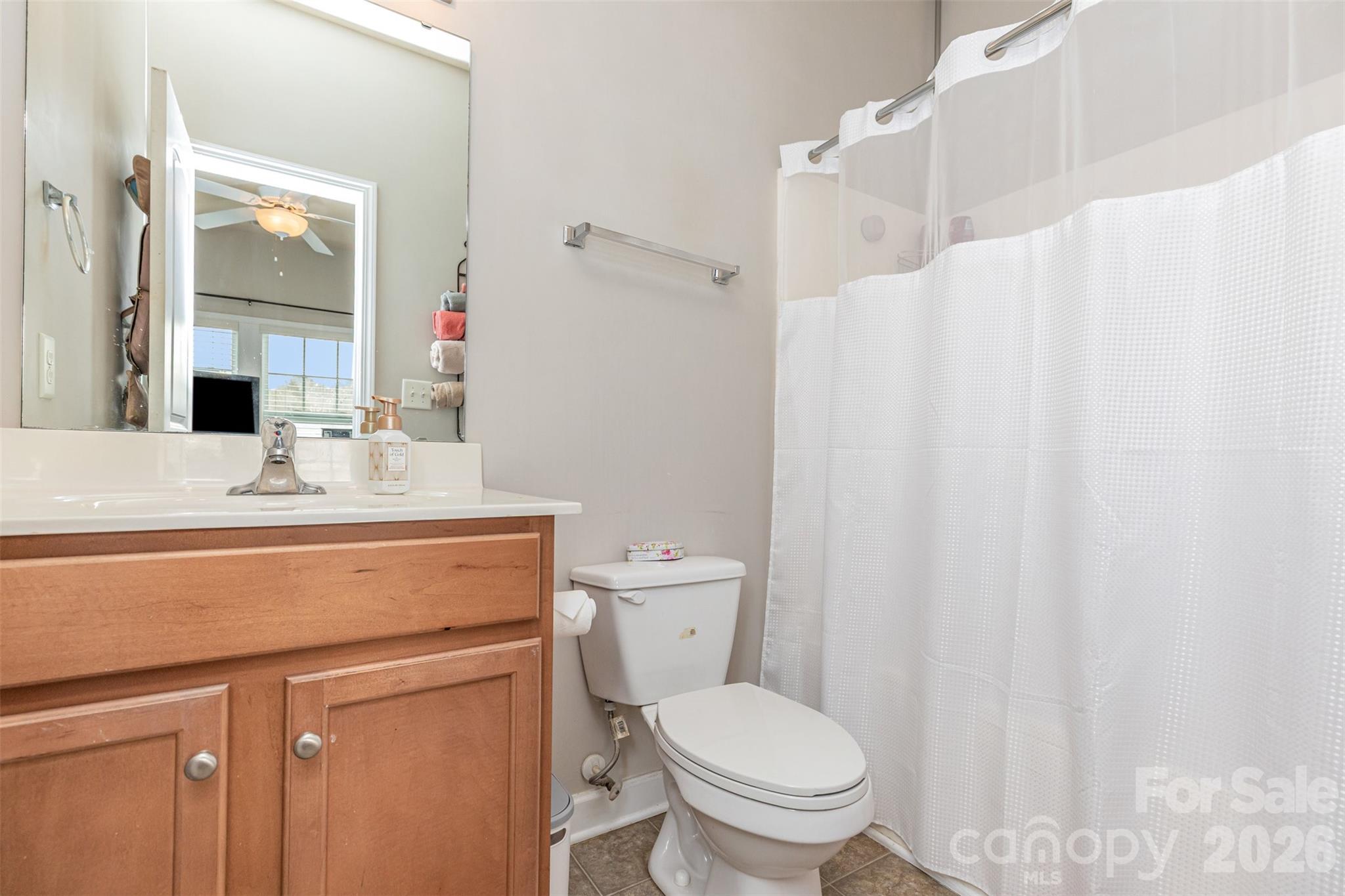 7167 April Mist Trail Huntersville, NC 28078 - Photo 12 of 19 a bathroom with a sink toilet and shower