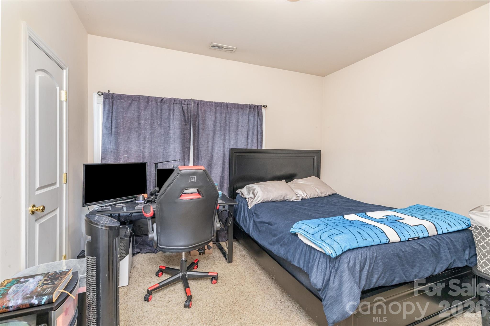7167 April Mist Trail Huntersville, NC 28078 - Photo 13 of 19 a bedroom with a bed and a chair