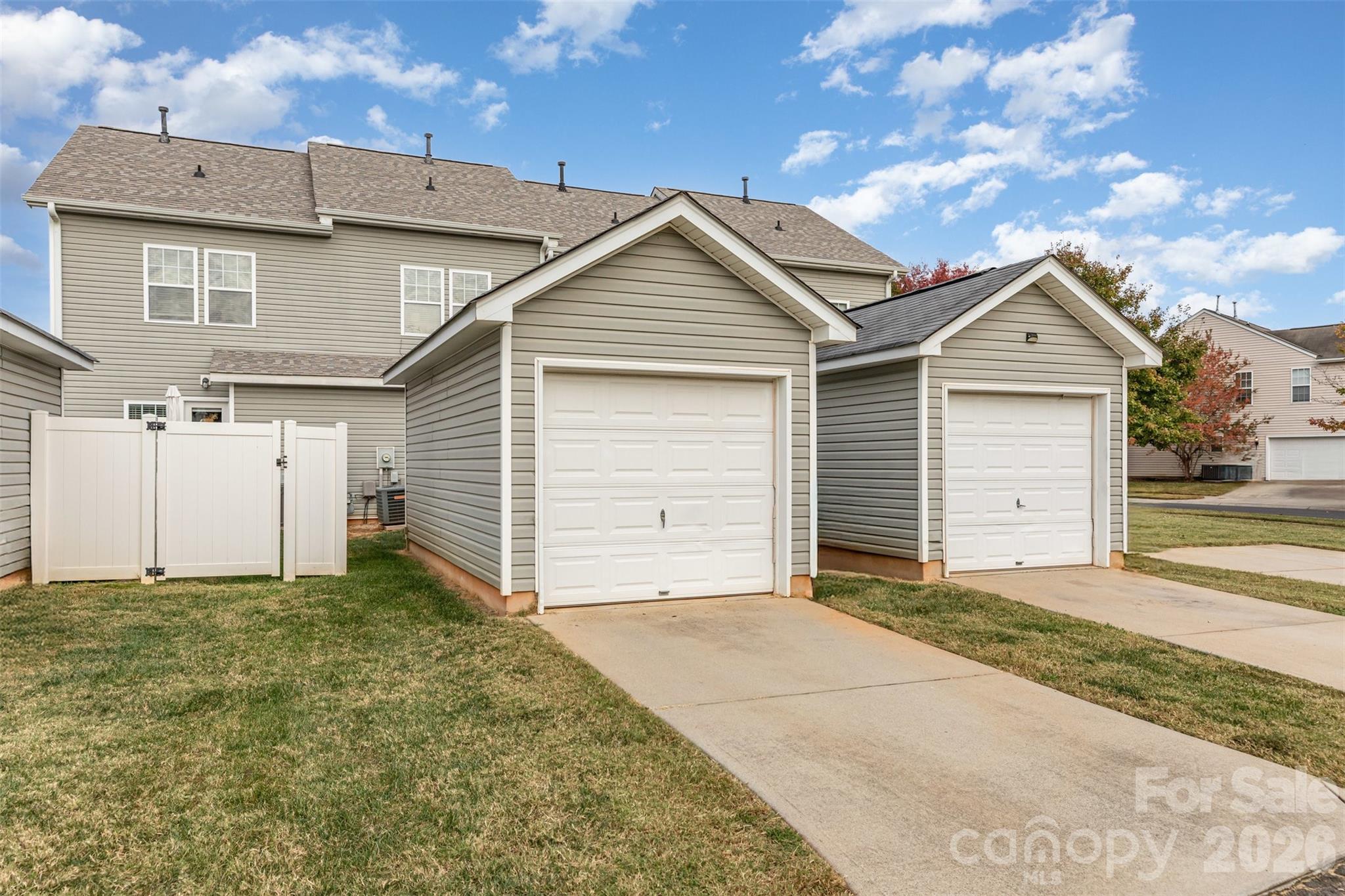 7167 April Mist Trail Huntersville, NC 28078 - Photo 15 of 19 a front view of a house with a garage