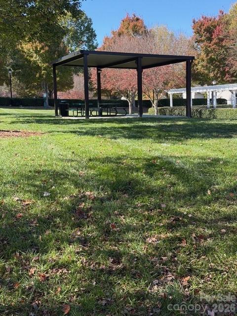 7167 April Mist Trail Huntersville, NC 28078 - Photo 18 of 19 a view of a big yard with plants and large trees