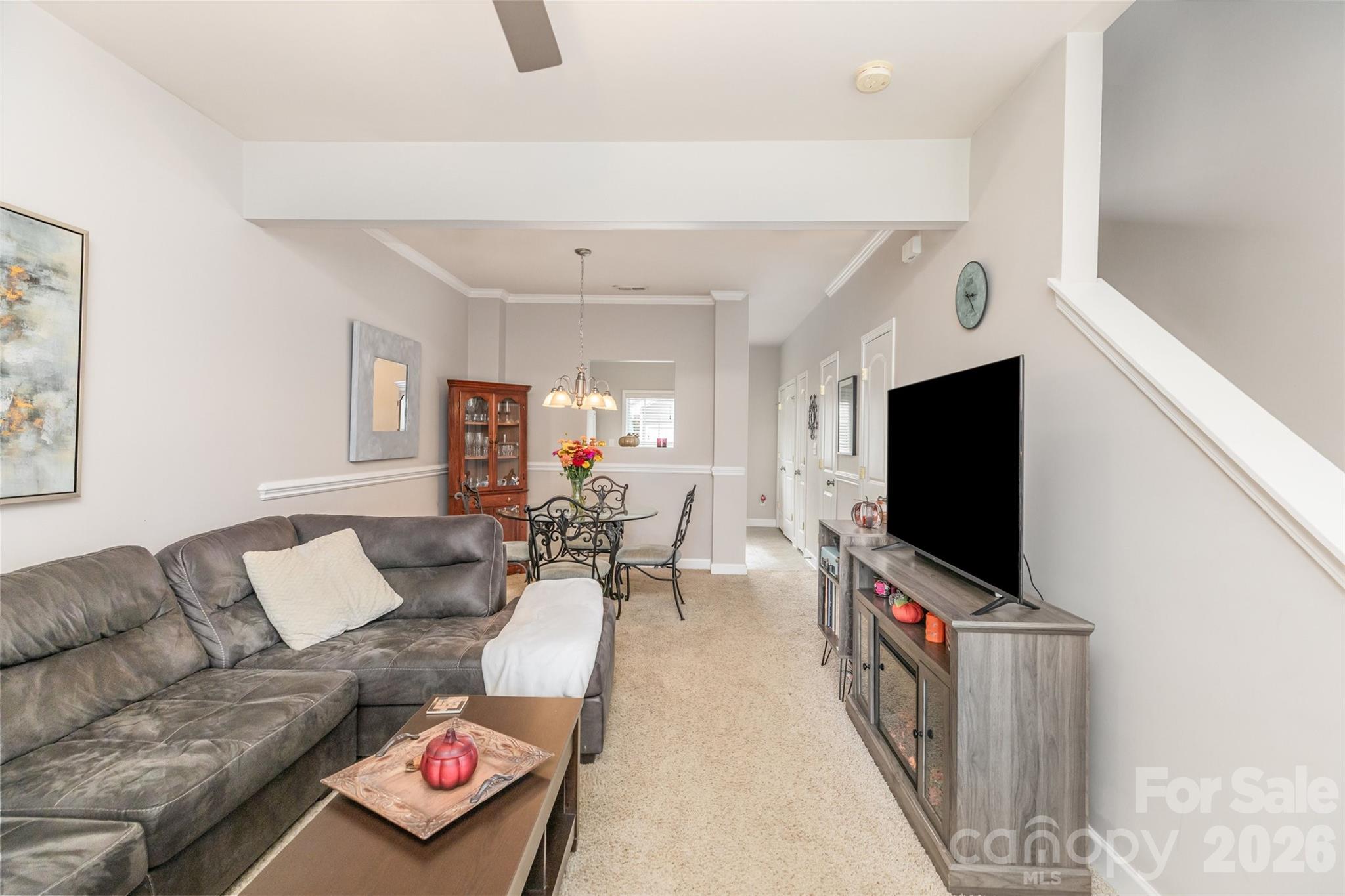 7167 April Mist Trail Huntersville, NC 28078 - Photo 5 of 19 a living room with furniture and a flat screen tv