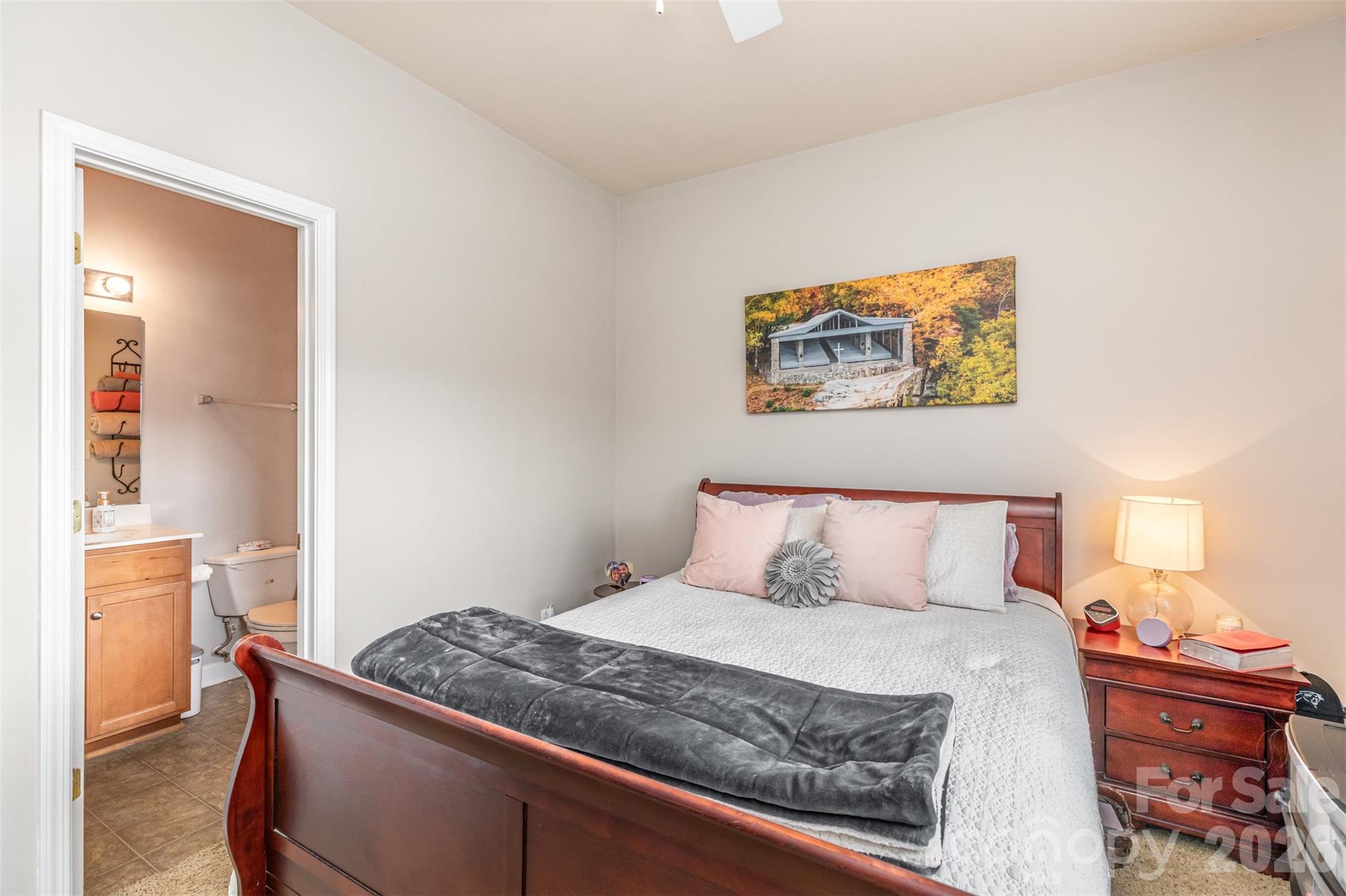 7167 April Mist Trail Huntersville, NC 28078 - Photo 10 of 19 a bedroom with a bed and a painting on the wall