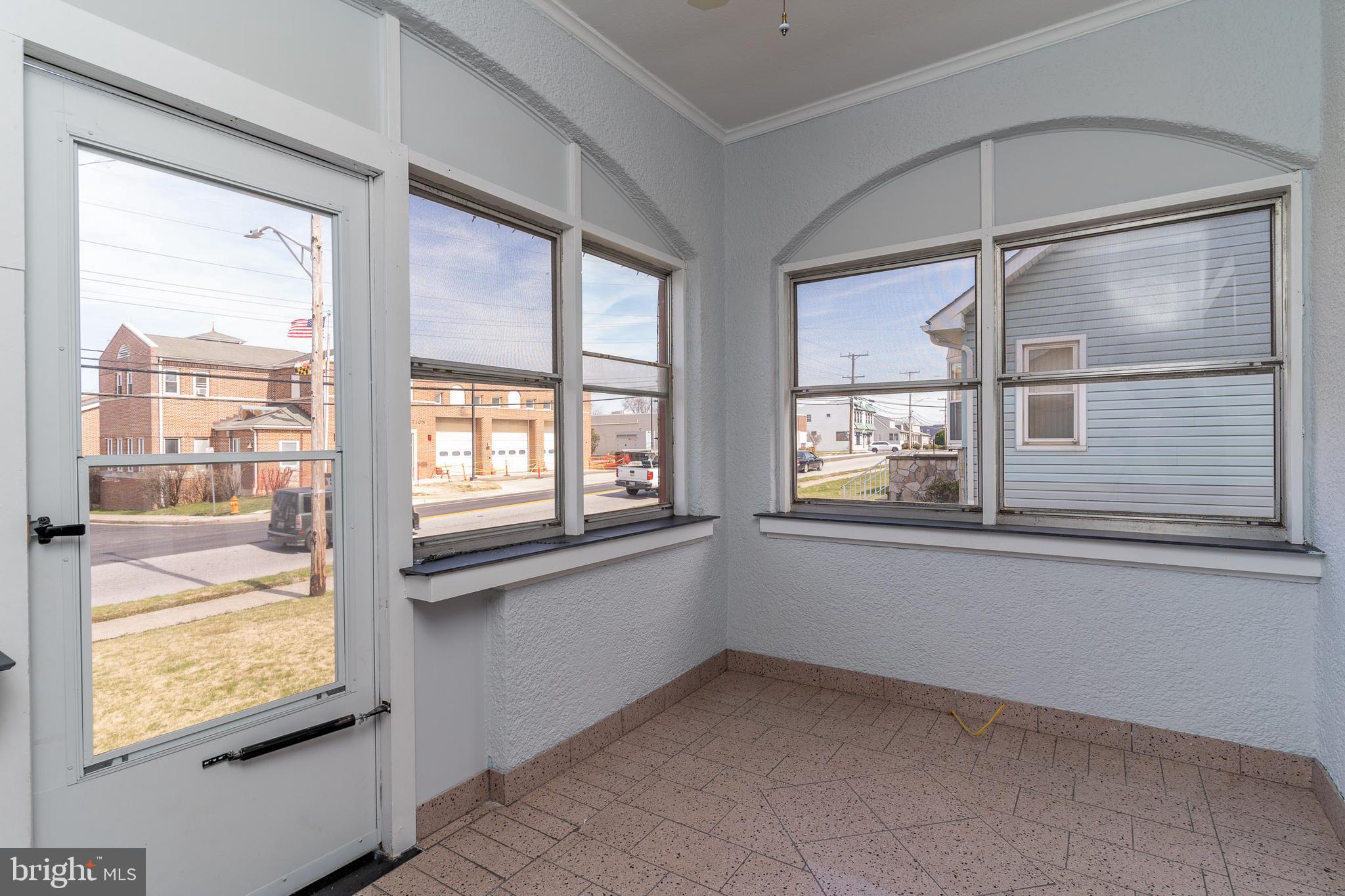 6801 North Point Road Sparrows Point, MD 21219 - Photo 4 of 36 You're greeted by a sunroom full of natural light