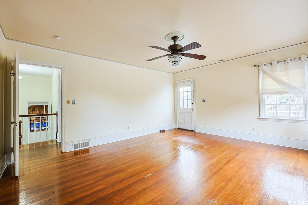 509 Beaty Street Conway, SC 29526 - Photo 18 of 40 Unfurnished room with hardwood / wood-style flooring and ceiling fan